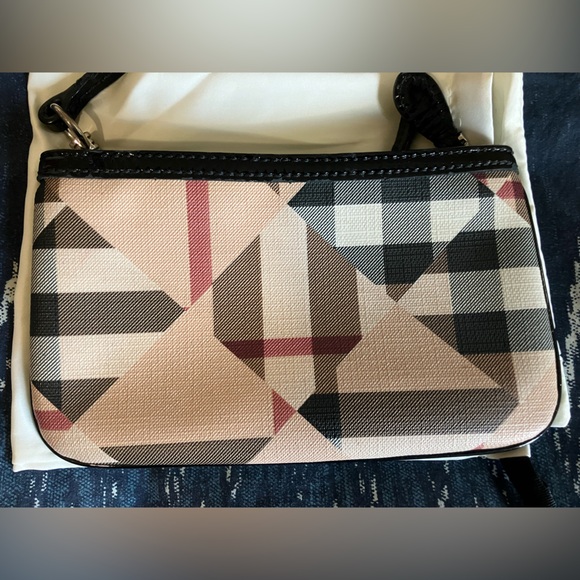 Burberry Handbags - $ firm Burberry Wristlet Large